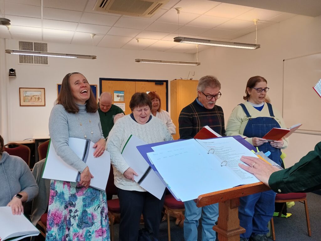 Emma and others singing at our Torch Retreat.